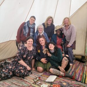 Group photo of ladies in a tent