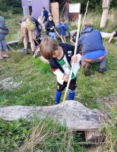 boy whittling a stick